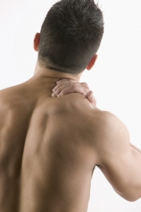 Man Rubbing Aching Neck Back pain is the number one cause of disability for Americans today